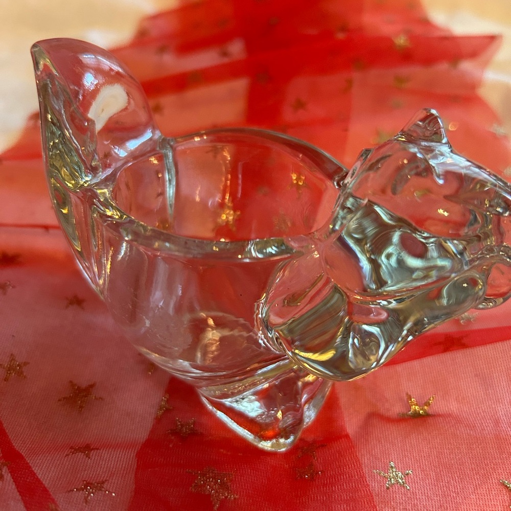 Elegant Clear Glass Accent Piece. It is a Squriel with a space for a Votive.